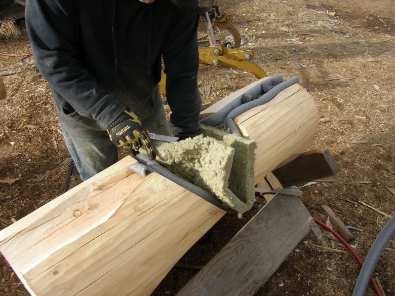 Batt Insulation cut to fit log notch