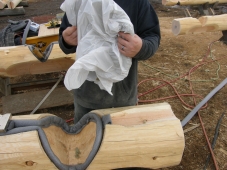 Plastic envelope to seal batt insulation in notches