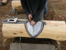 tuck plastic envelope under the Log home gasket in the notch